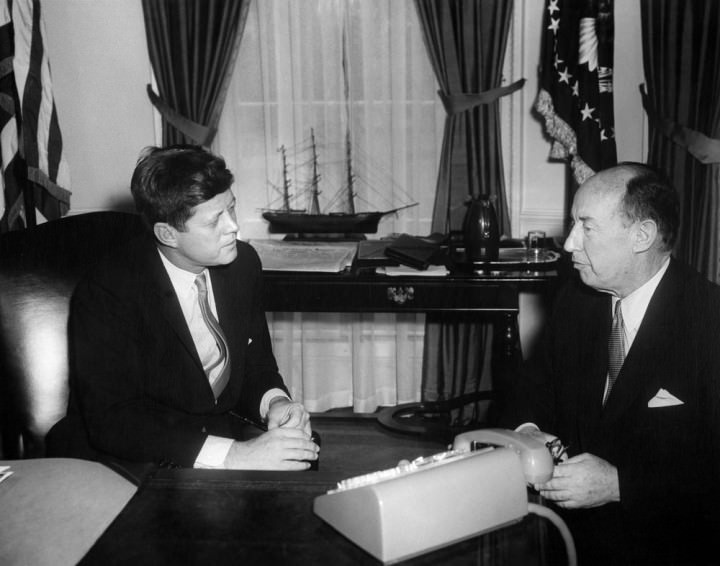 President John F. Kennedy with Adlai Stevenson, US Representative to the United Nations. Oval Office, White House, Washington, D.C. Photo by Abbie Rowe (National Park Service). JFK Library.